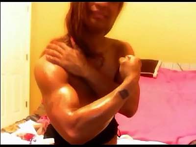 Muscular Black Cam Chick With Powerful Arms