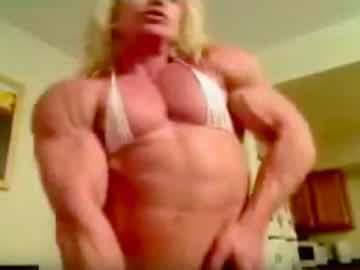 Blonde Female Bodybuilder Dena Pumps Up Her Large Muscles