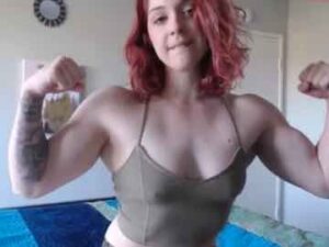 Muscular Redhead Chick Flexing Her Big Biceps